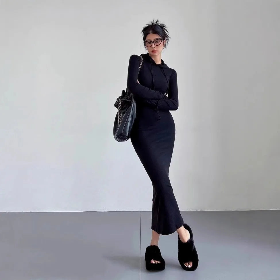 A woman's grey hooded long sleeve sheath dress with an over-the-knee length and high waist.