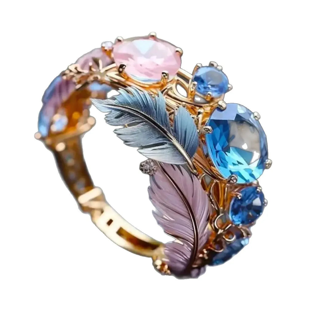 Gold colour embossed feather ring with colourful design and geometric shape