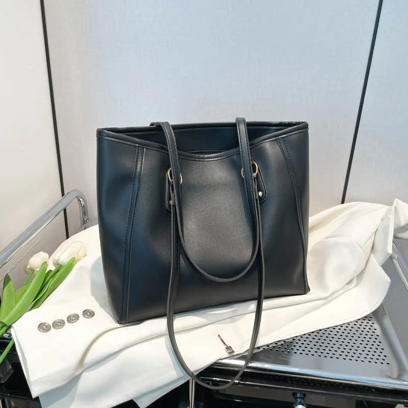 Contrast colour PU leather tote bag showing internal organisation compartments and external slit pocket