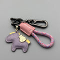 Handmade cowhide leather key ring pendant with zinc alloy pony buckle and coloured flanelle rope.