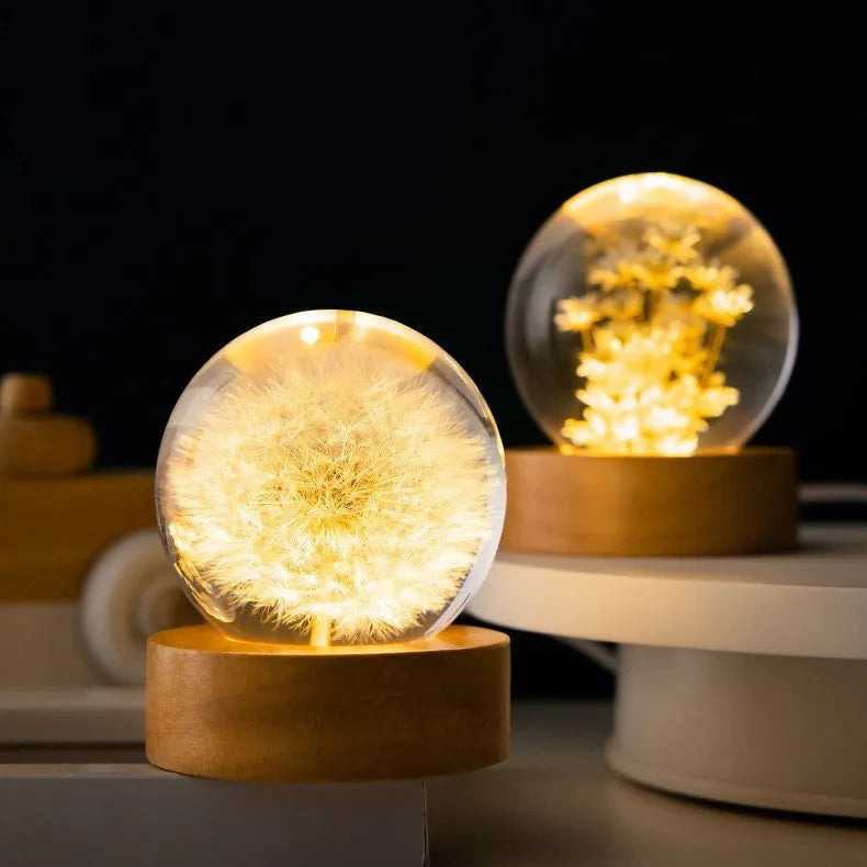 Preserved dandelion inside a glowing 60mm crystal ball on a beech wood stand, USB desktop night light.