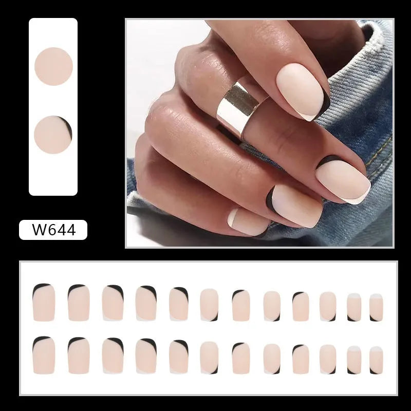 Black and white frosted matte false nails with French style design on display