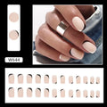 Black and white frosted matte false nails with French style design on display