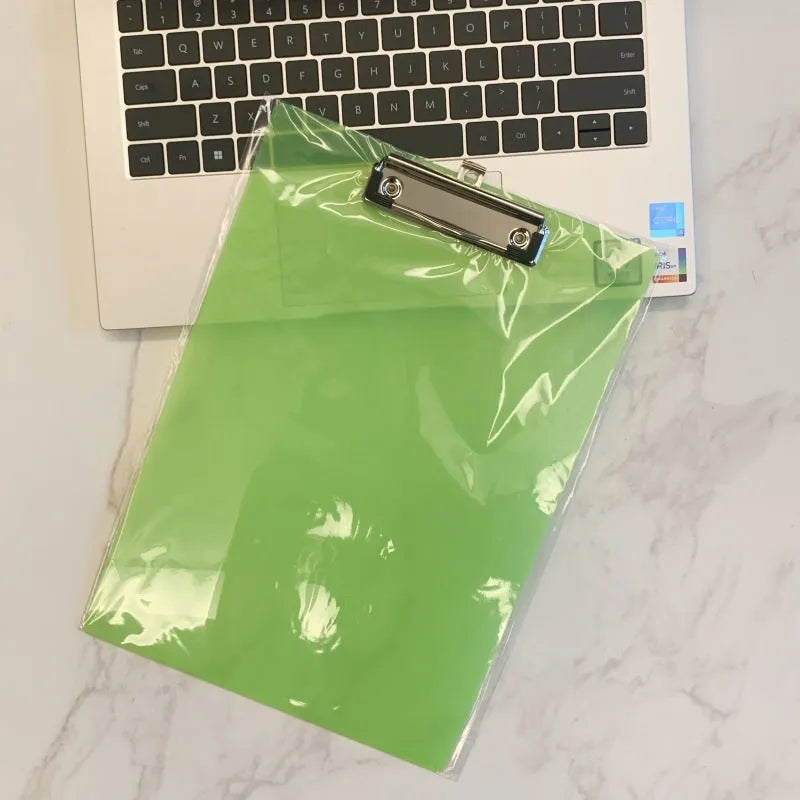 Transparent A4 plate holder with metal clip, shown in blue, acting as a writing board and document folder.