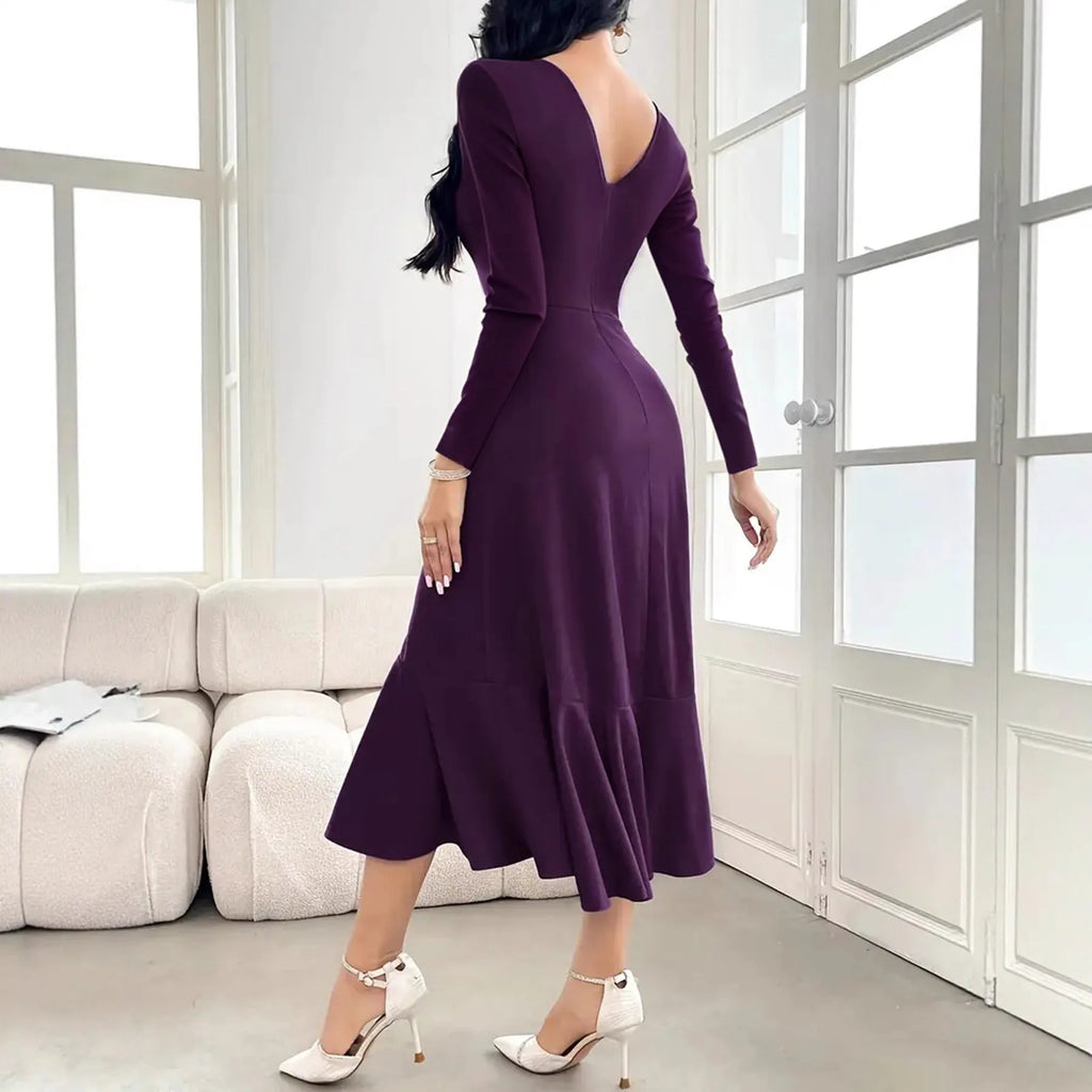 Purple women's long sleeve dress with ruffles and a round neck, showing mid waist fit.
