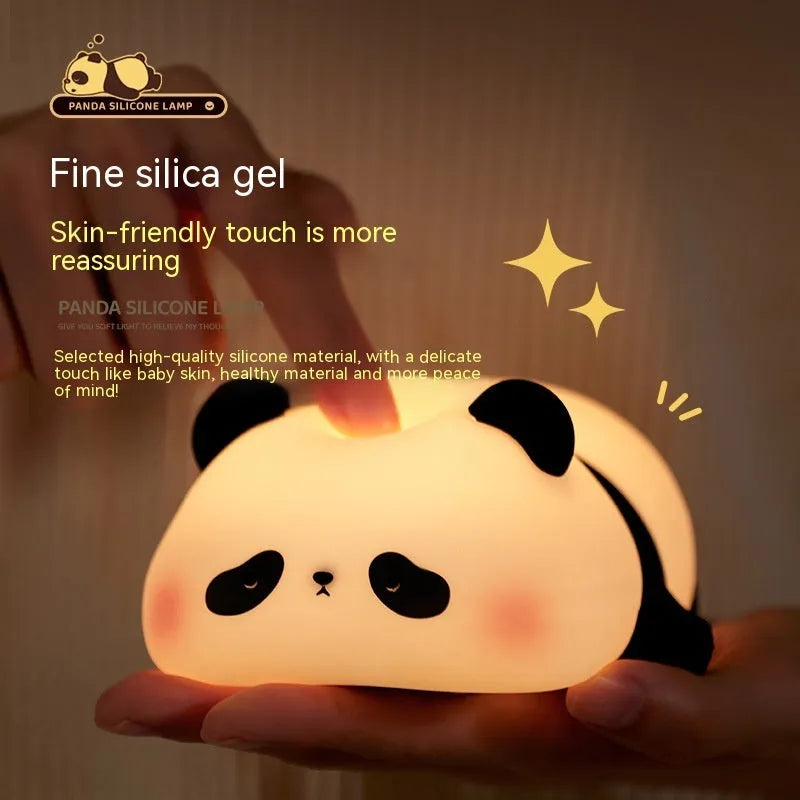 Cartoon panda-shaped night light with soft white glow on dark surface