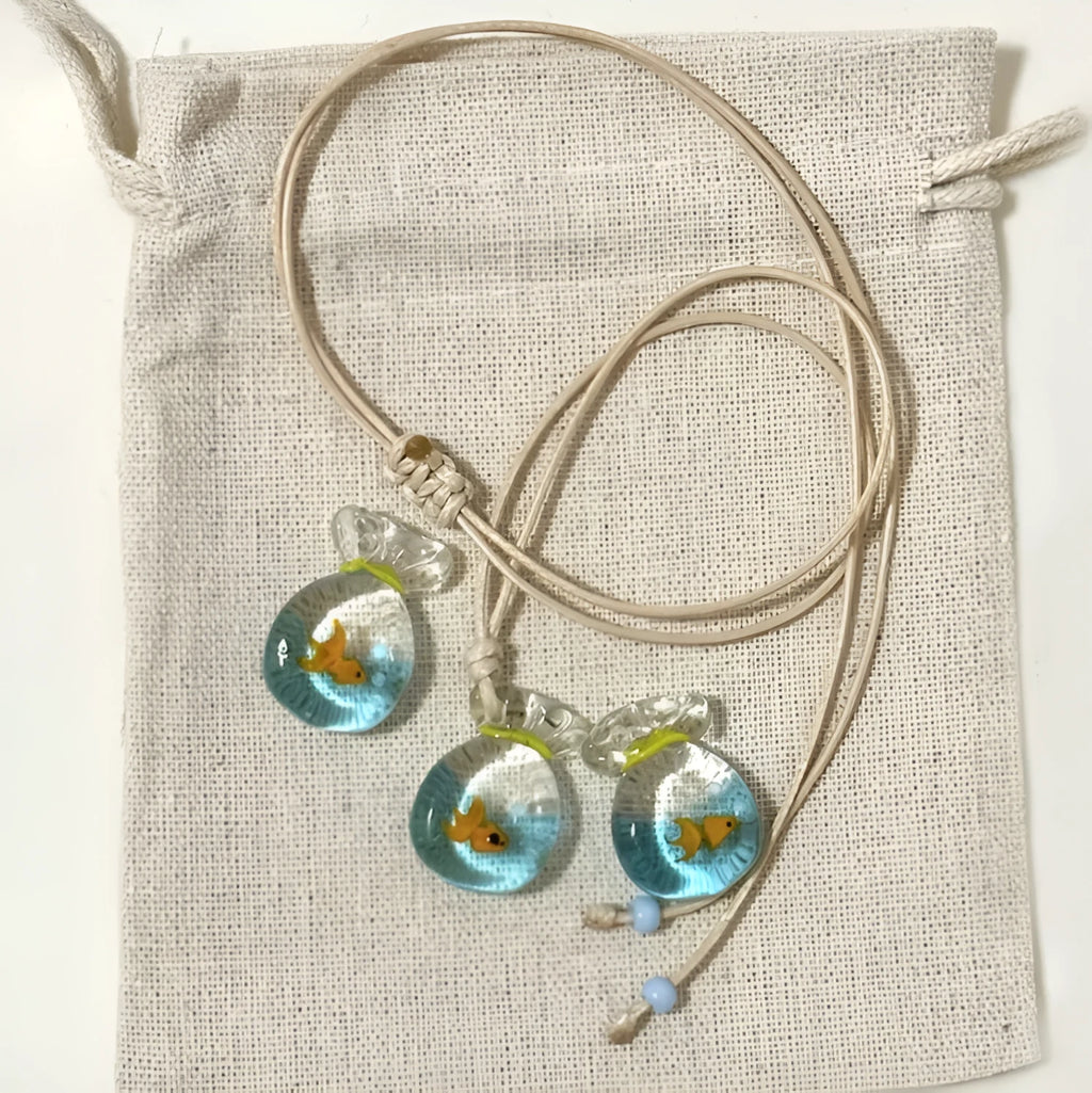 Women's necklace with a coloured glaze joker skirt pendant on a cotton and linen clavicle chain.
