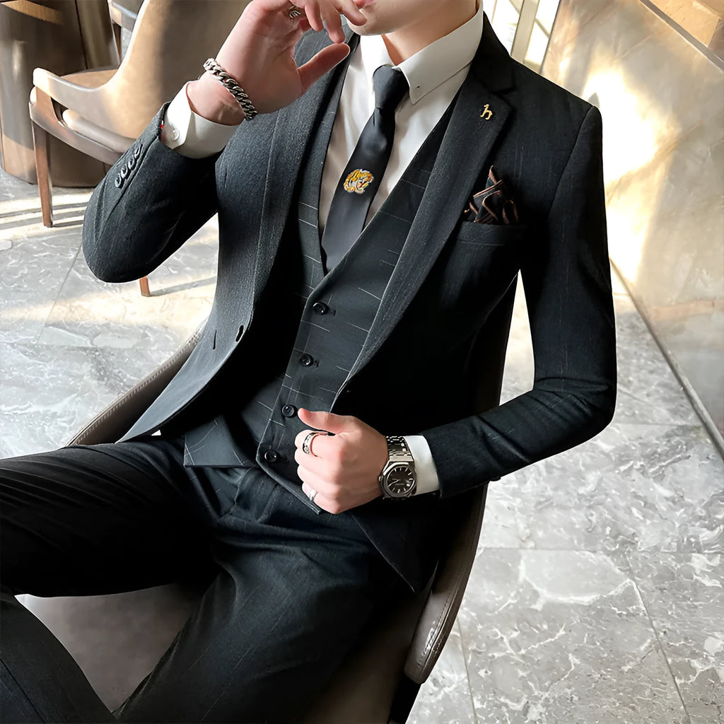 Slim fit men's business suit in black or dark grey cotton blend fabric with adhesive interlining construction