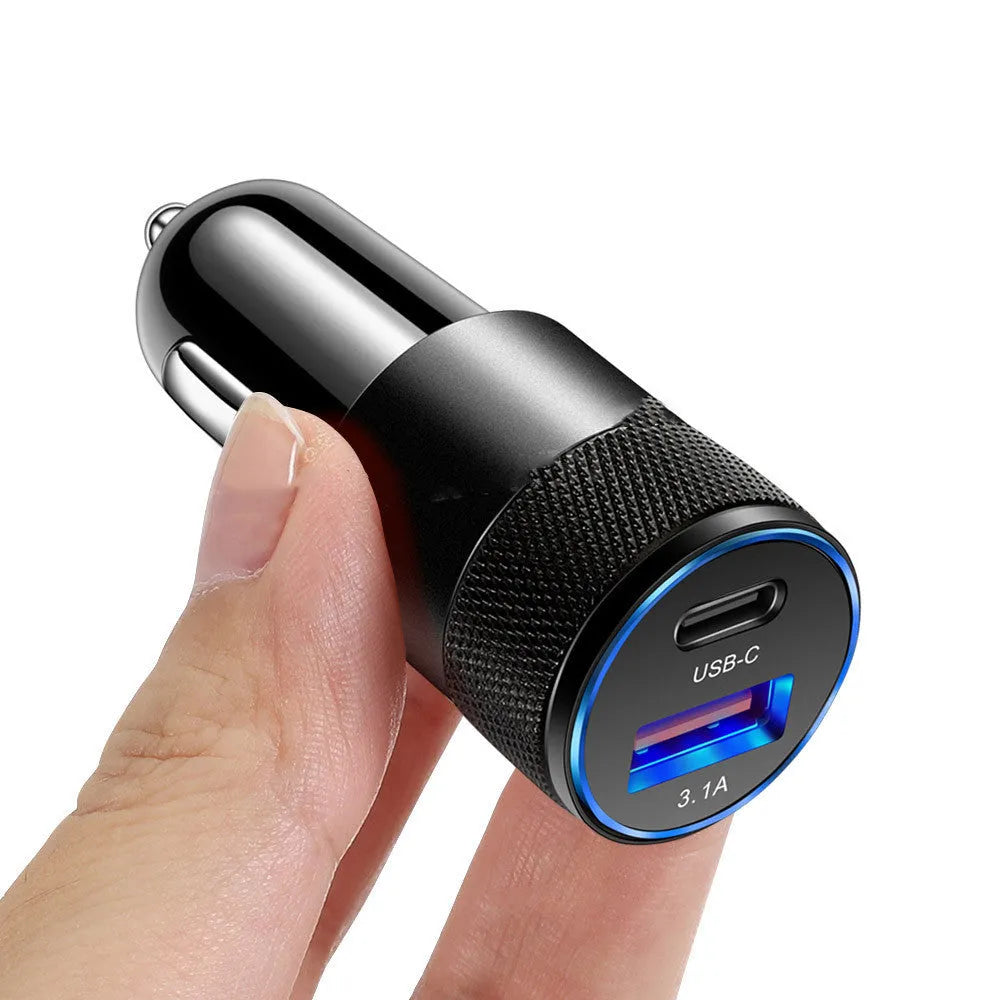 Compact black aluminium alloy mobile phone car charger for vehicle 12V socket.