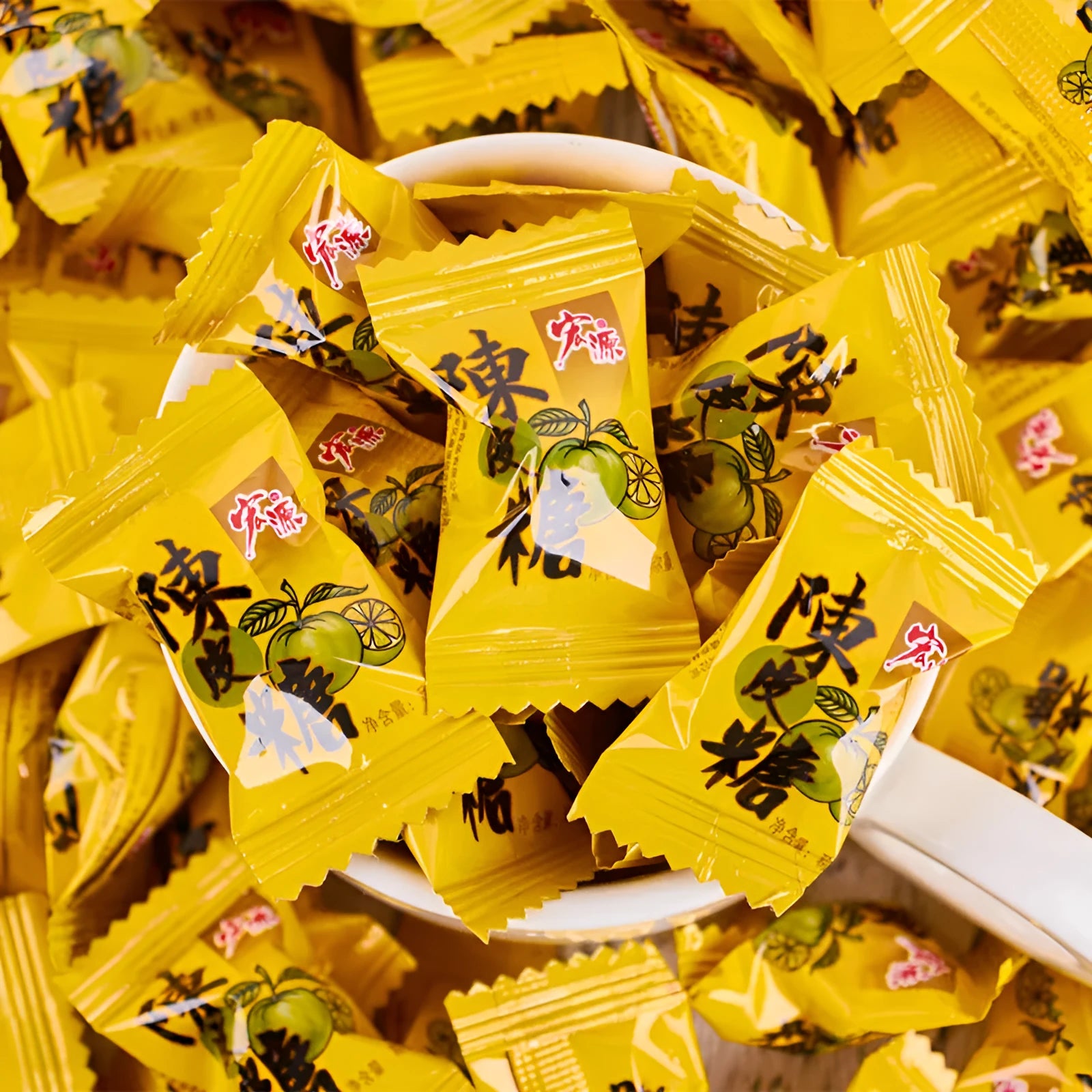 Assortment of guava, plum sugar, and tangerine peel hard candies in a gift pack bag.