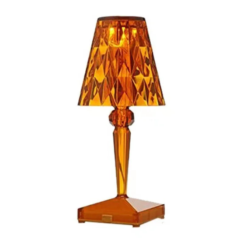 Rose gold portable touch control night light with acrylic lamp holder on a wooden surface.