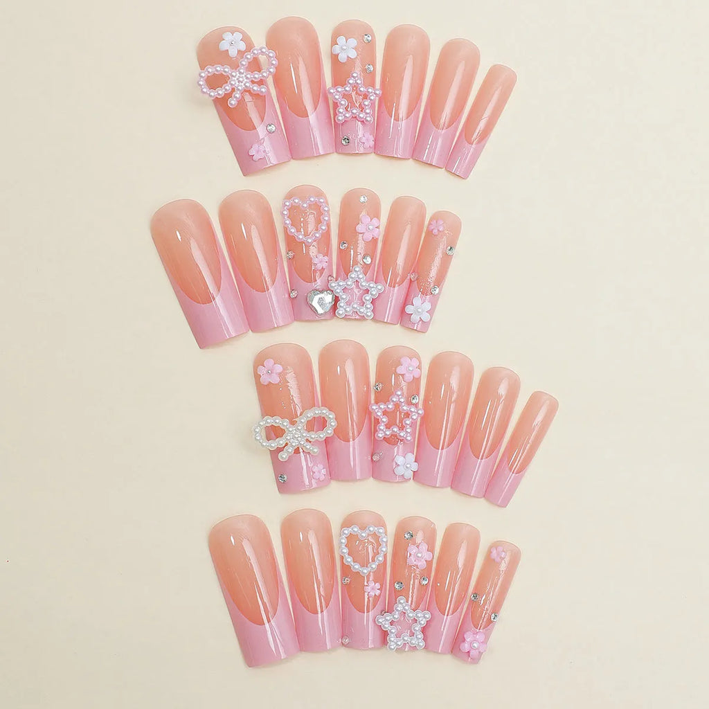 Super long water pipe shaped false nails with French spot and drill bow design in XB-70-48 pink.