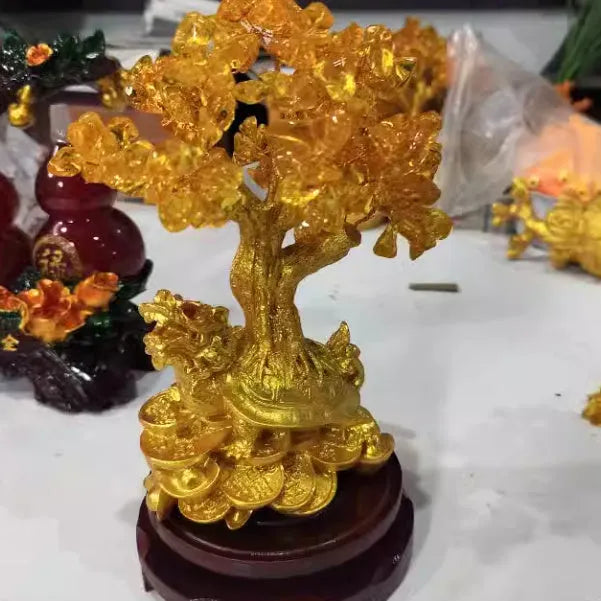 Citrine coloured resin Chinese style ornament of a small water turtle with a money tree.
