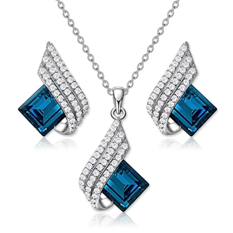 Glass and alloy necklace and earring set with cross chain design and electroplated metallic finish