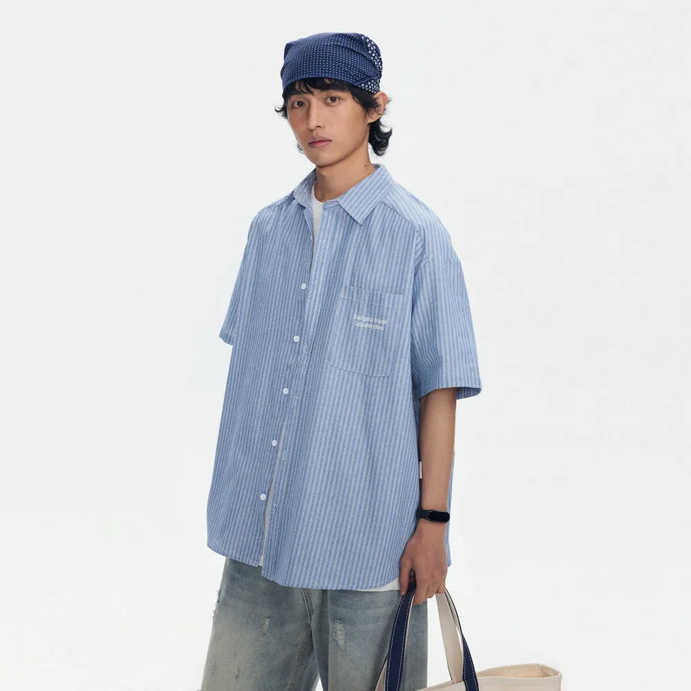 Blue striped loose short-sleeved shirt in cardigan style on a hanger