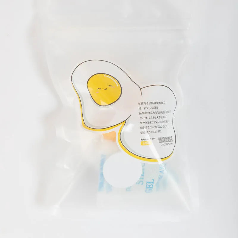 Interactive catnip ball toy in fried egg and poached egg shapes with natural filling
