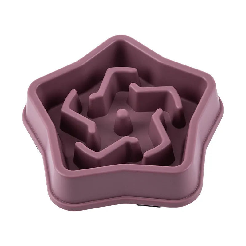 Yellow plastic dog slow feeding bowl with textured bottom surface for choking prevention