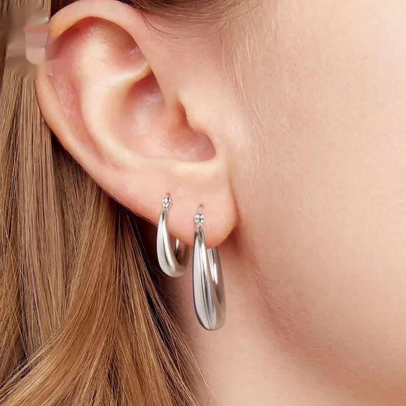 Silver-tone geometric ring clip-on earrings for women, shown in three sizes.