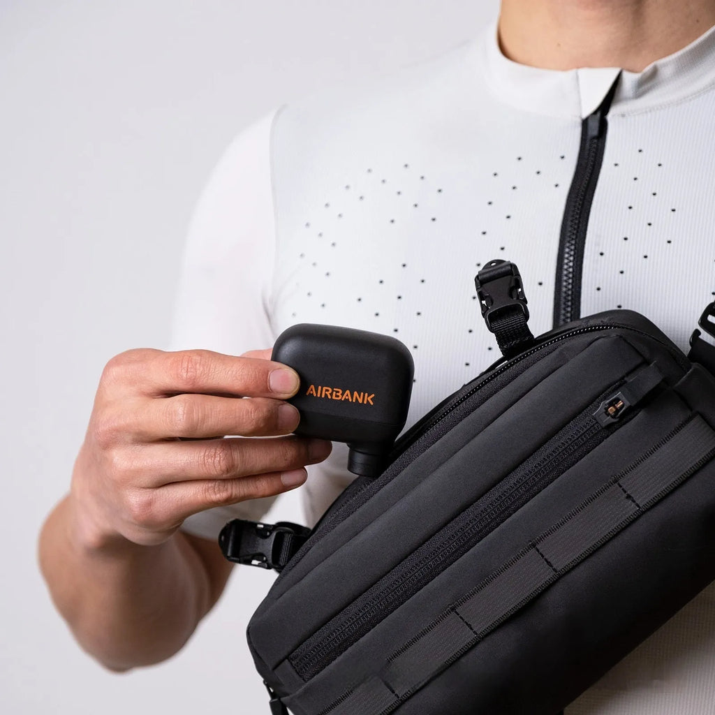 Black mini electric bicycle pump with USB charging port and compact dimensions