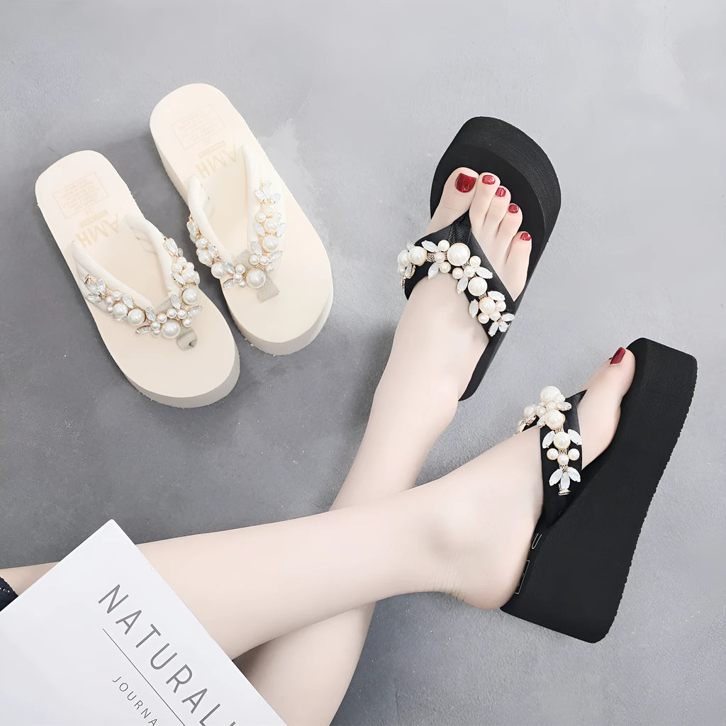 Women's black cotton high-heeled flip-flop sandals showing elevated sole and cloth upper