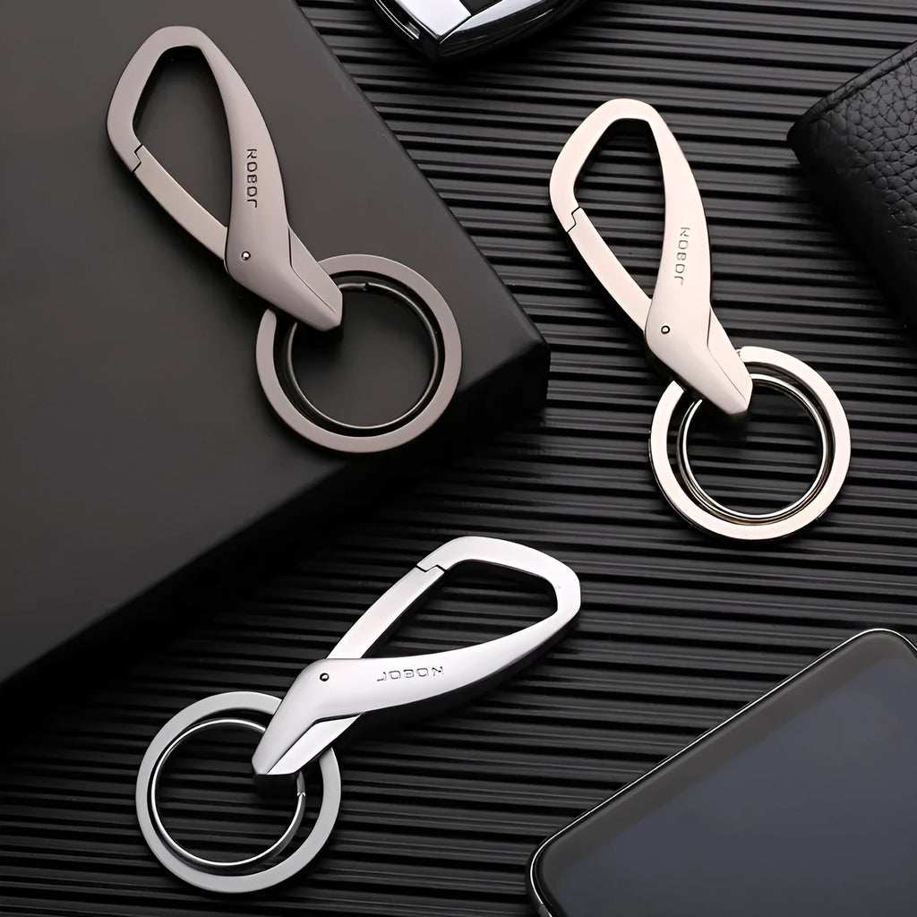 Simple double ring metal keychain in zinc alloy, shown in black, chrome, and nickel colour options.