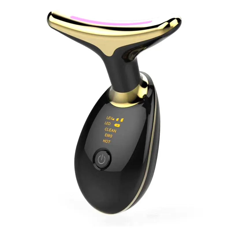 White EMS thermal neck lifting massager device with LED lights, shown with USB cable and moisturiser.