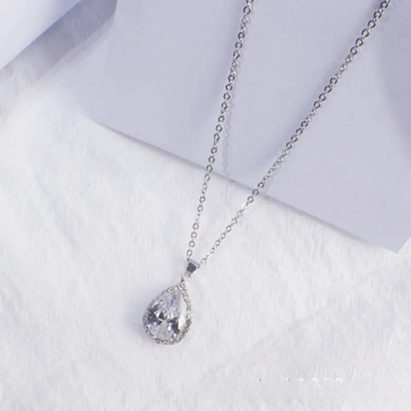 Rose gold water drop necklace with geometric rhinestone pattern in pink colour
