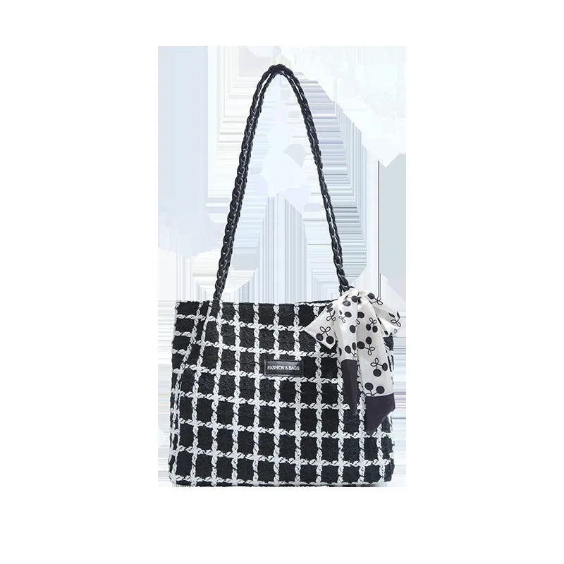 Black wool shoulder bag with horizontal square shape showing interior file compartment and phone pocket