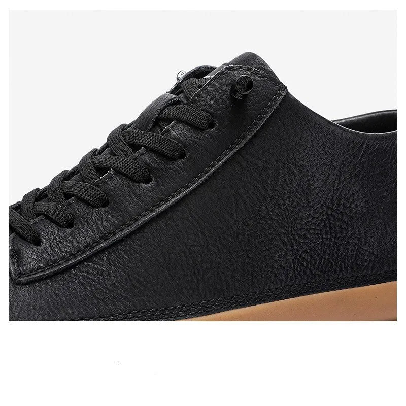 Men's black leather casual shoes with round toe and flat rubber sole on white background