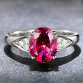 A women's court-style ring with a natural zircon stone, showcasing heart, water drop, and bell pattern options in red, blue, green, and light blue.