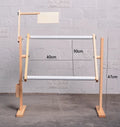 Vertical solid wood embroidery frame with height adjustment on desktop