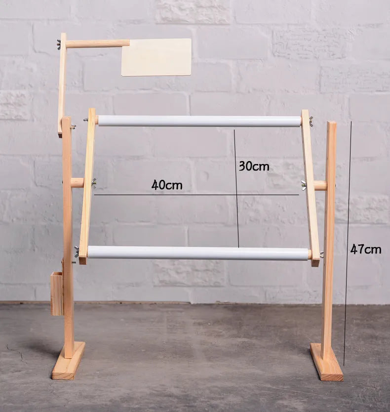 Vertical solid wood embroidery frame with height adjustment on desktop