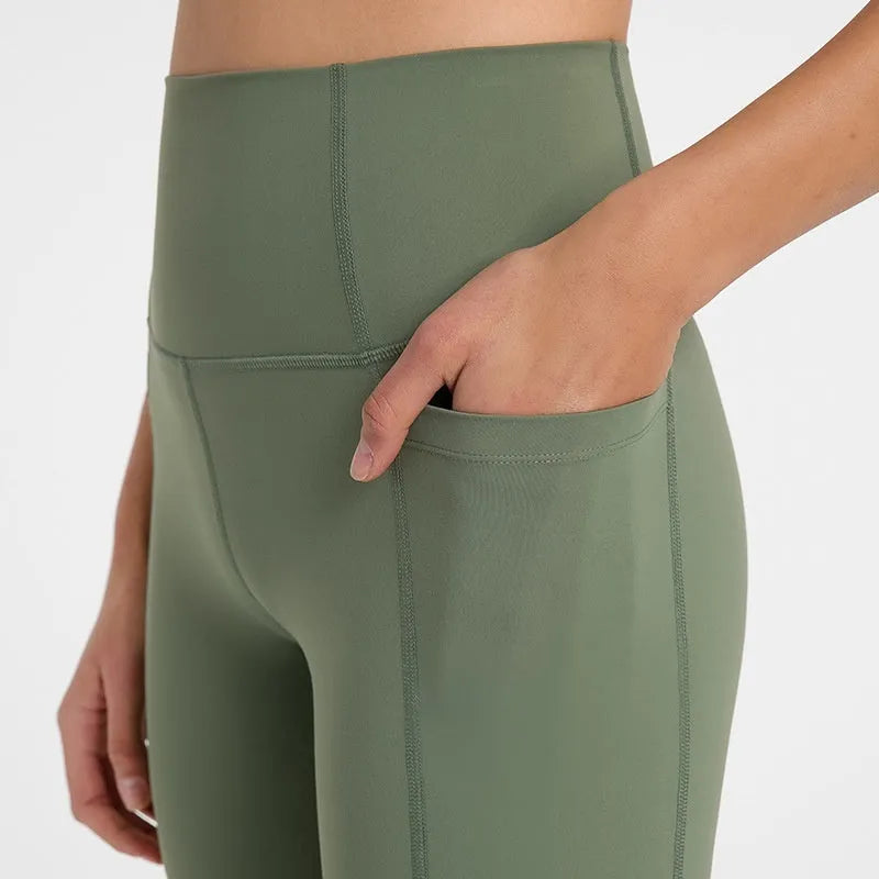 Women's tight-fitting sport shorts in a solid colour, shown on a model for running or gym use.