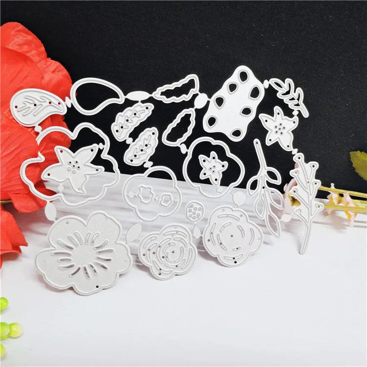 Silver carbon steel paper cutting die with floral plant design measuring 14.3 by 9.9 cm