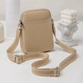 Solid colour PU leather mobile phone crossbody bag in beige showing shoulder strap and compact size