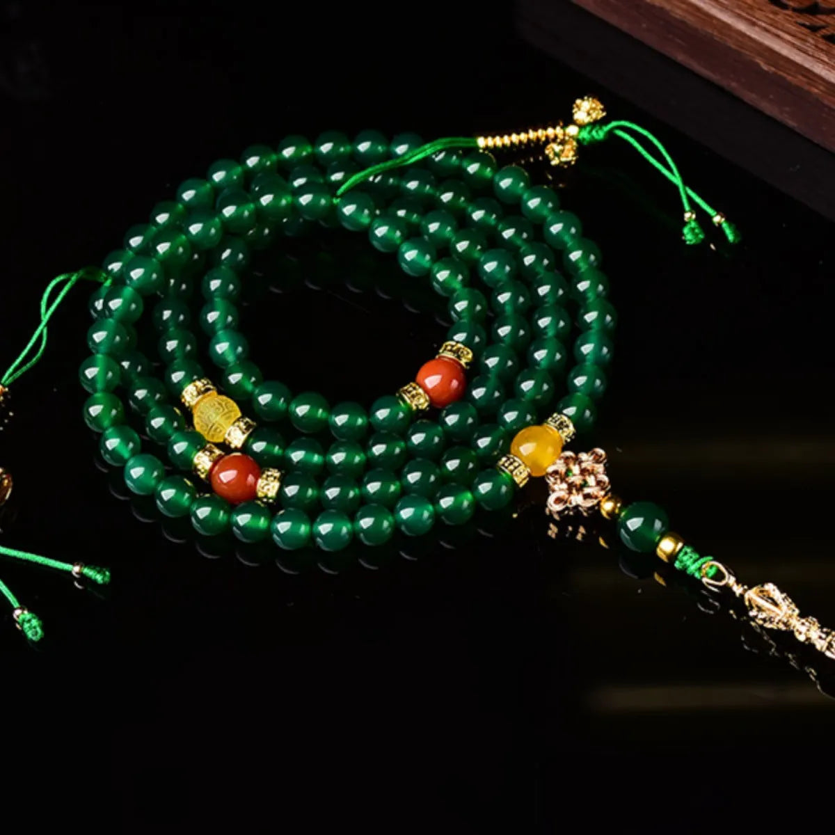 Natural green agate multi-circle bracelet for men and women on a wrist, showing bead detail.