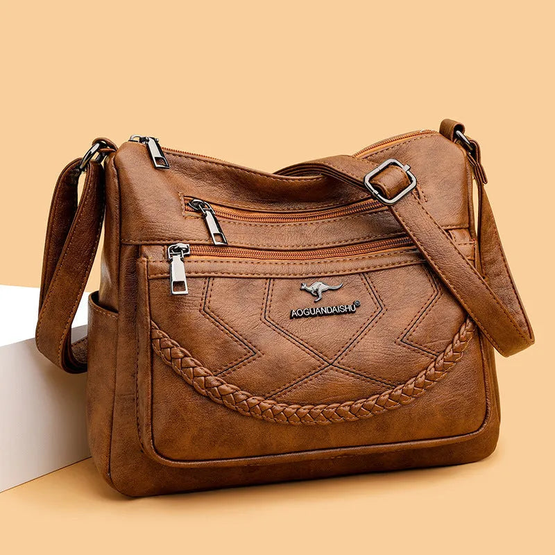 Soft black PU leather women's crossbody bag showing square shape and outer pocket