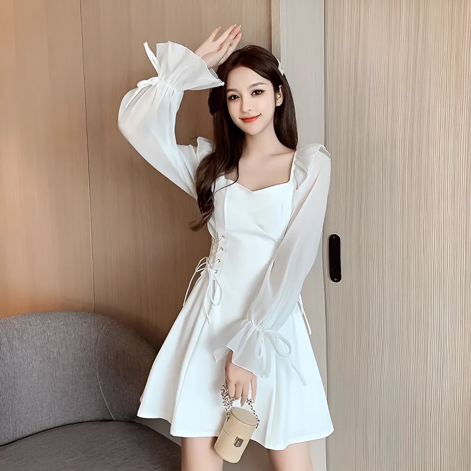 White chiffon patchwork waist-slimming dress with long sleeves and skirt on mannequin