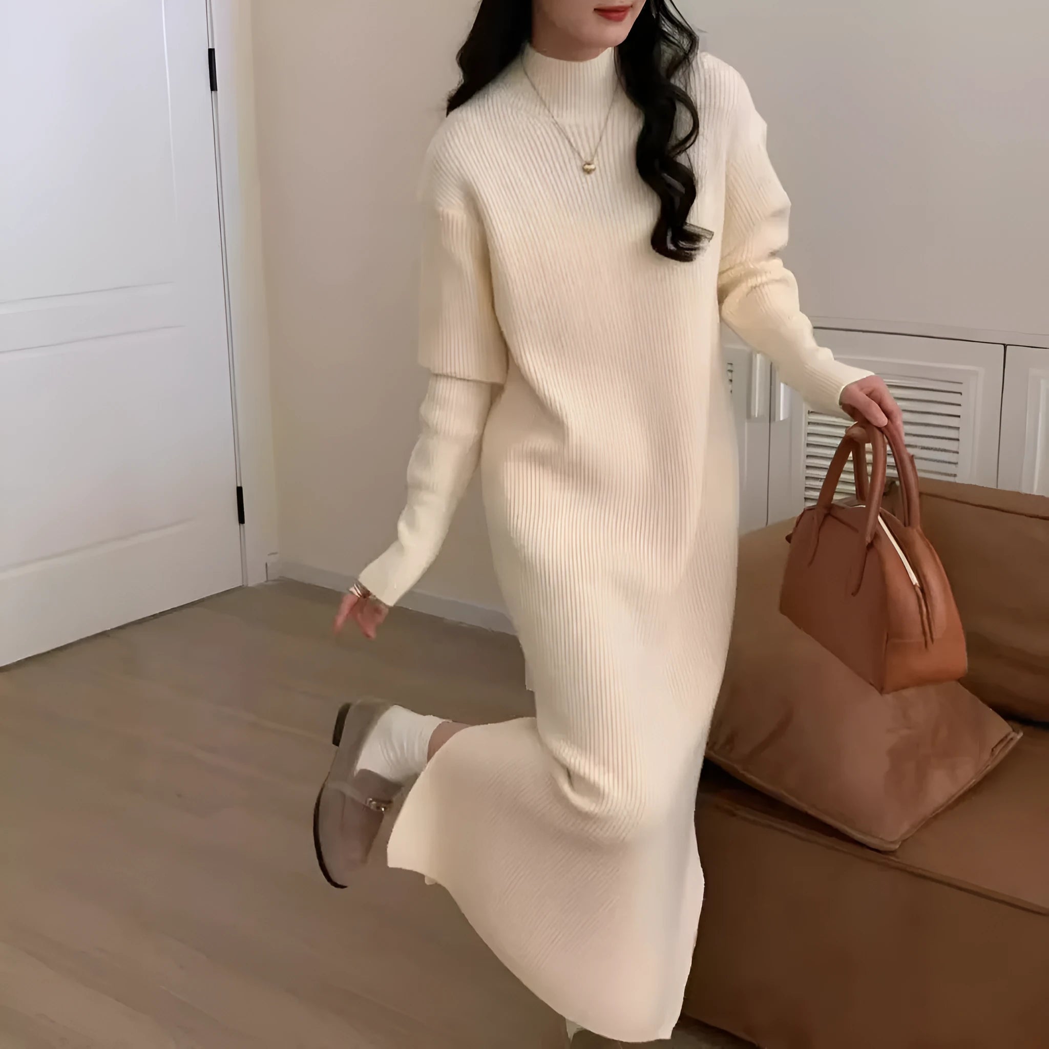 Half turtleneck knitted acrylic dress in graphite colour with overknee length and long sleeves.