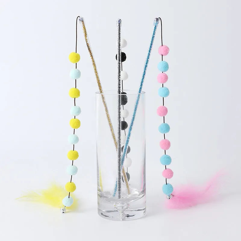 Cat teaser wand toy with plush ball, feathers, and plastic rod, about 31 cm long, random colour