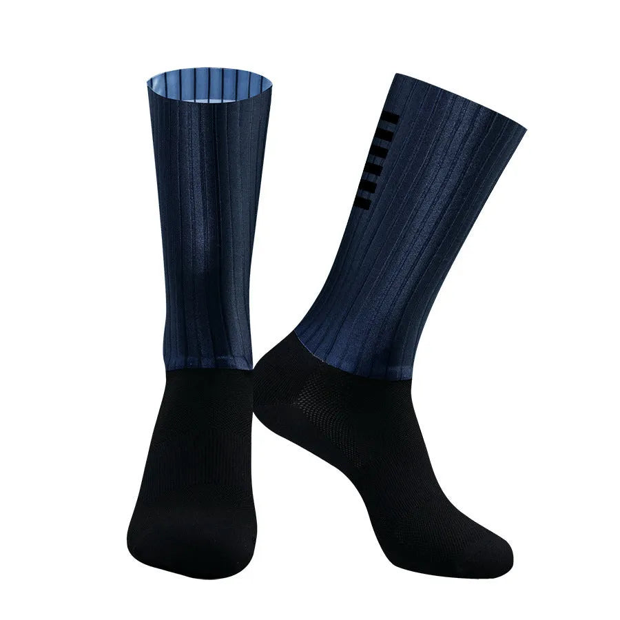 Athletic cycling and running socks in chemical fibre blend fabric, shown in orange, black, purple, white, grey or dark blue.