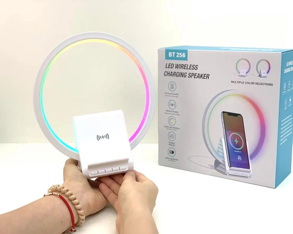 White rectangular smart Bluetooth speaker with wireless charging pad and ambient lighting
