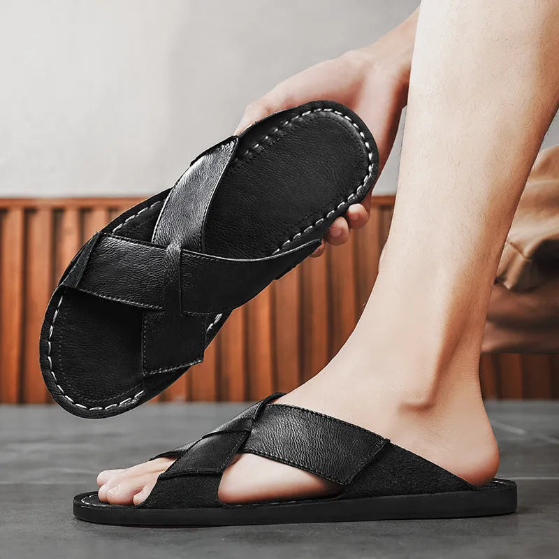 Men's black casual slip-on sandals made from genuine pigskin leather with a frosted finish and rubber sole.