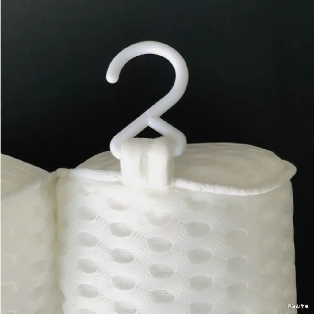 White 4D mesh bathtub pillow with seven suction cups, shown on a bathtub.
