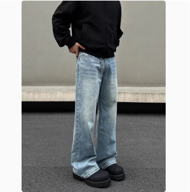 Men's blue straight leg denim jeans with whisker wash detailing and visible stitching on a medium-high waist.