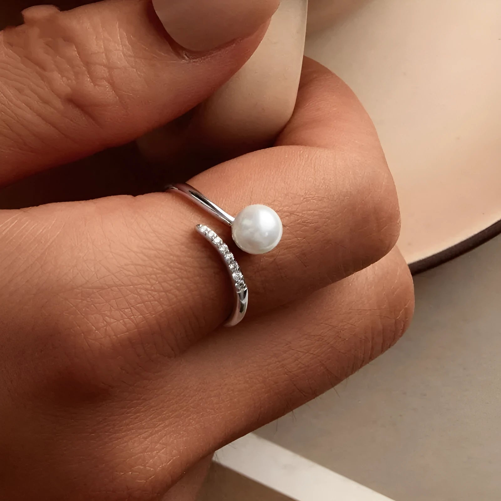 Sterling silver adjustable ring with natural shell pearls on open band design