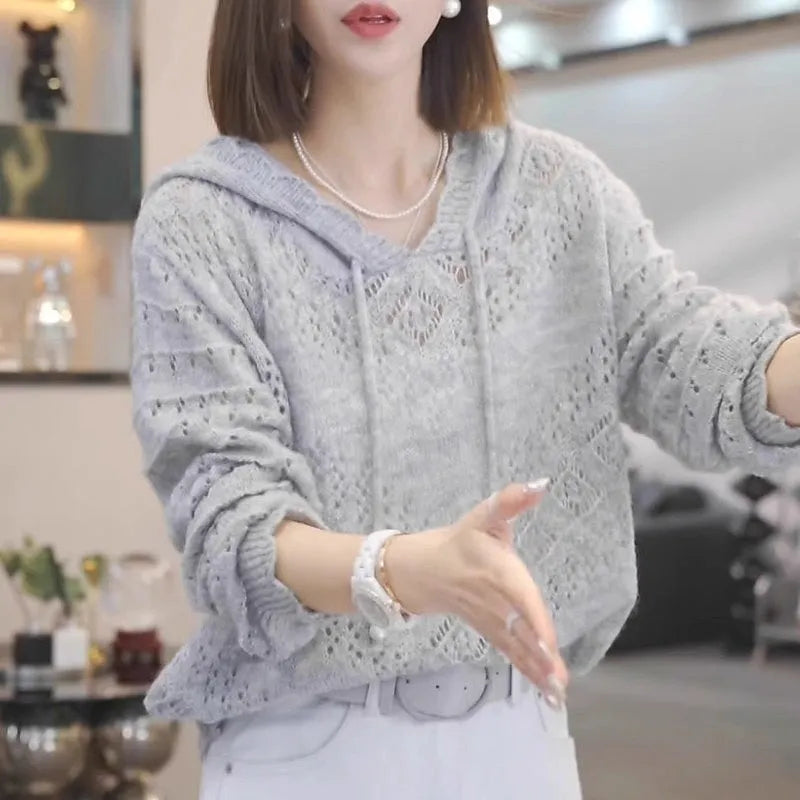Women's loose crochet hooded longsuit undershirt in blue, showing hollow knit texture and long sleeves.