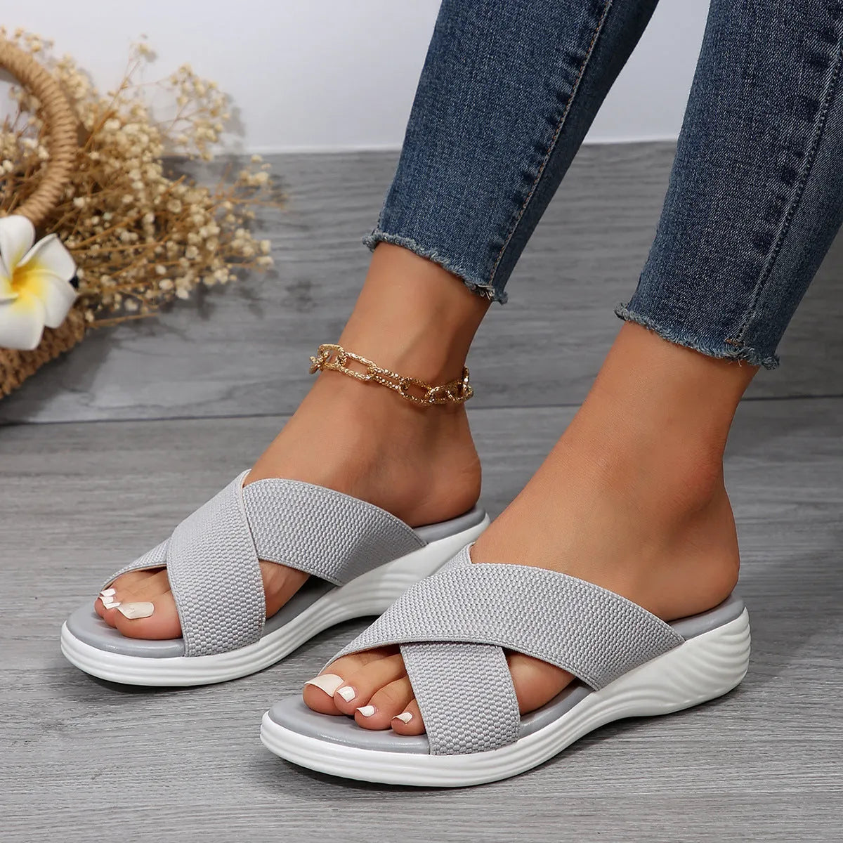 Women's black wedge slippers with peep-toe design and thick rubber sole