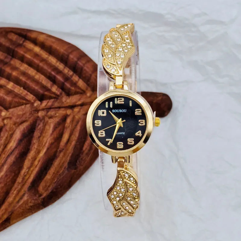 Stainless steel women's watch with round dial showing gold surface option and vachette clasp