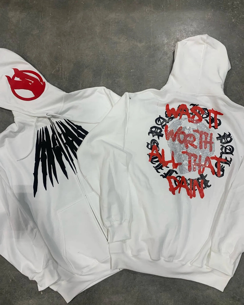 Black hooded sweatshirt with printed skull pattern and rhinestone detailing in loose cardigan style